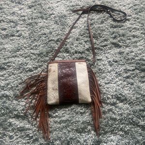 Cow hide crossover bag